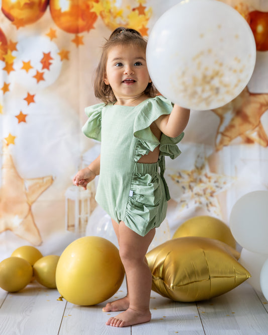 mace and co kids clothing dubai, romper with bow back in mint green colour, linen fabric material, for girls ages infant, toddler up to seven years old, perfect for birthday parties, special occasions and formal wear.